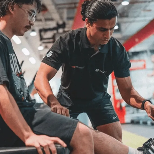 Personal trainer guiding a client through a structured 30-minute workout session